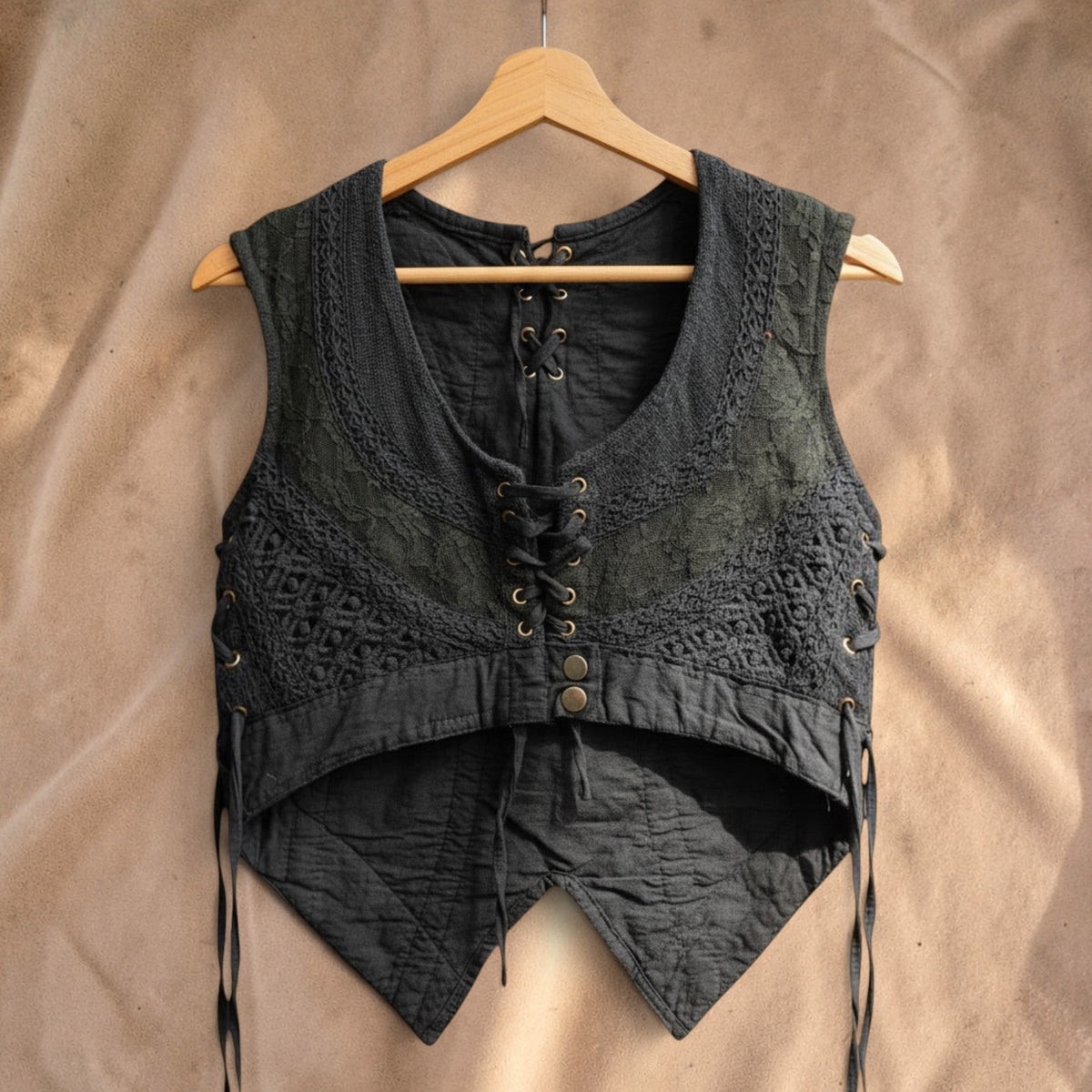 Valentina Artisan Gilet in black featuring layered textures, intricate lace patterns, and a front lace-up closure.