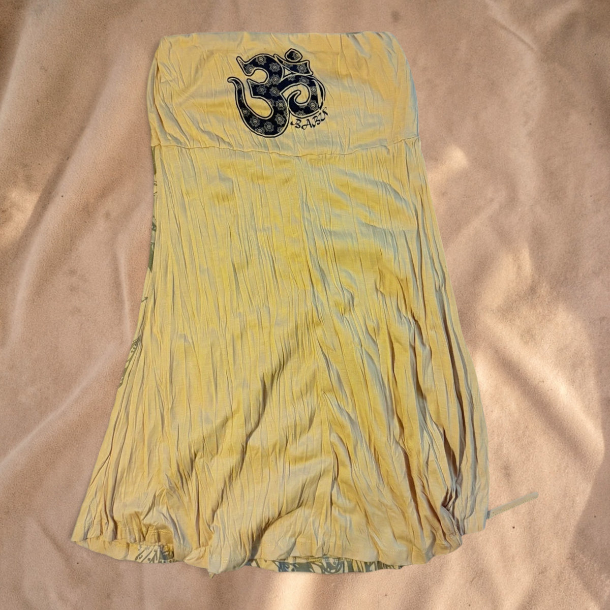 Valentina Om Spirit summer dress in light sand with a prominent Om print and comfortable airy fit.