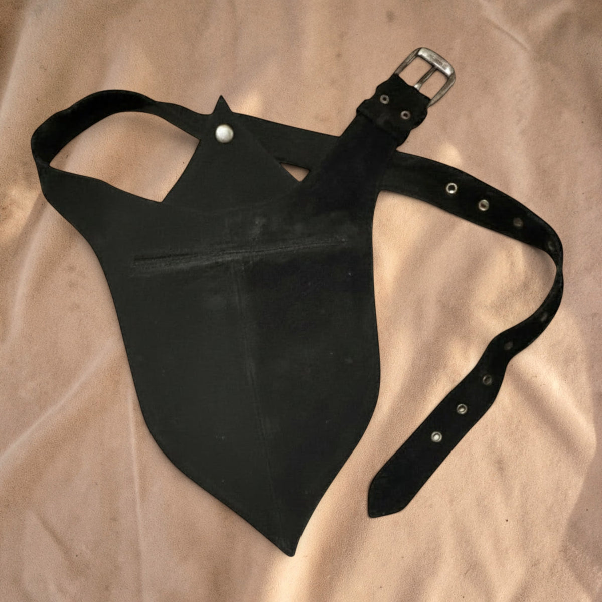 Valentina Raven Leaf black leather waist bag with a unique leaf-shaped flap and adjustable buckle strap.