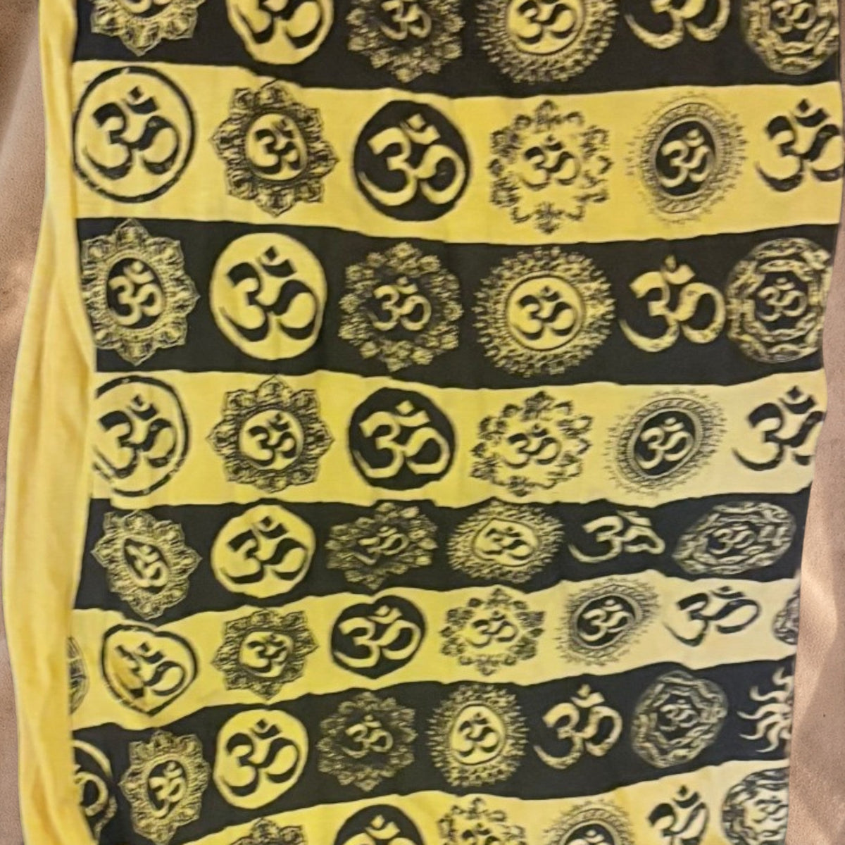 Valentina yellow and black summer dress with repeating Om symbol print and soft, lightweight fabric