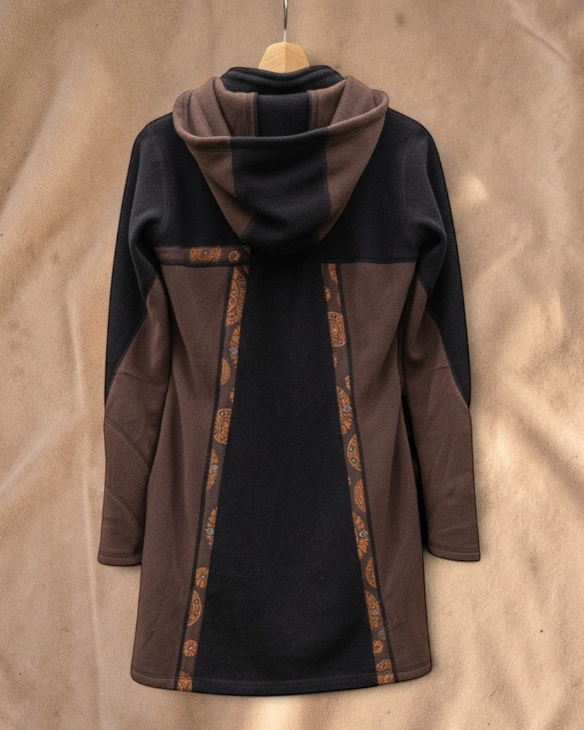 Valentina Nomad Layer Jacket in dark woods featuring soft fleece, an asymmetrical pattern, and a spacious hood.