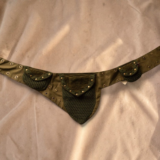 Valentina Nomad fanny pack in olive green with crochet textures, lace details, and multiple storage pockets.