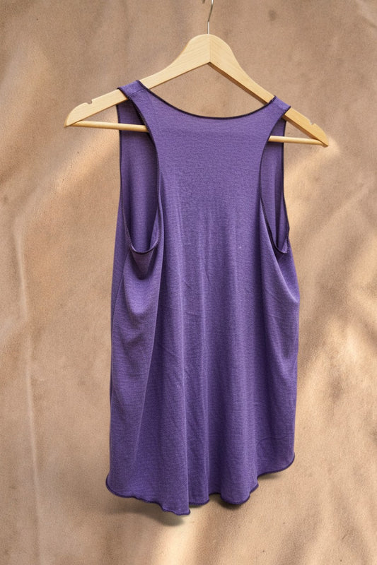 Valentina purple Shadow Feather Top with a racerback design and airy, lightweight fabric on a wooden hanger.