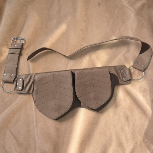 Valentina Twin Leaf fanny pack in soft brown leather with two leaf-shaped compartments and an adjustable strap.