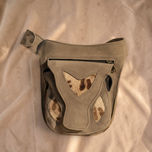 Valentina Wild Path waist bag in taupe suede with animal print accents and multiple zippered compartments.